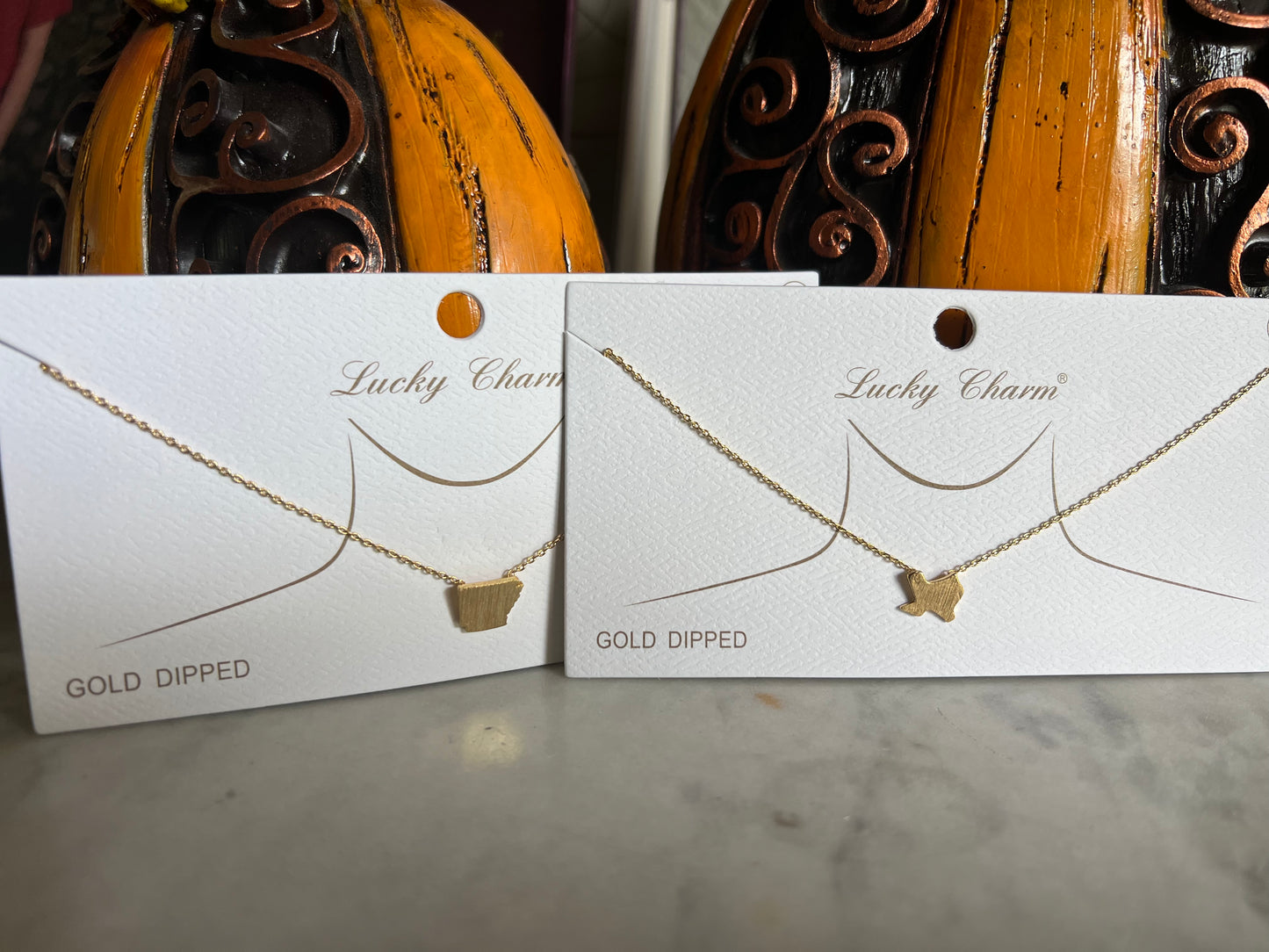 Gold state necklaces
