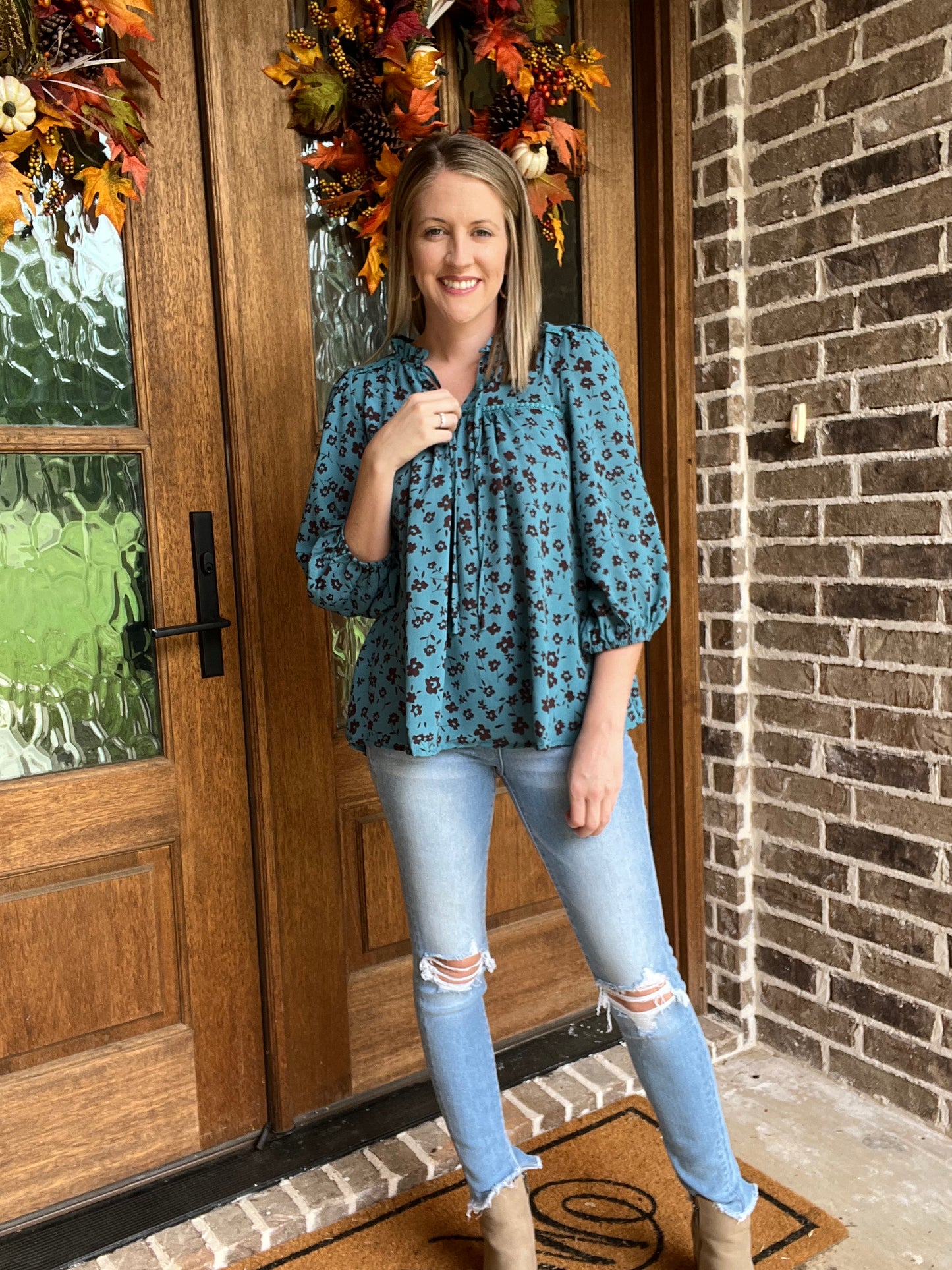 Teal floral print ruffle neck top