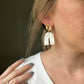 Gold and white earrings